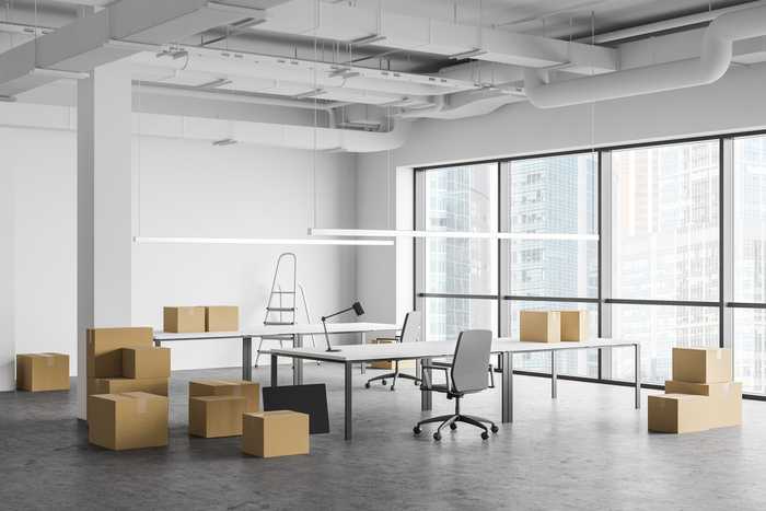 Large open office space with packed boxes